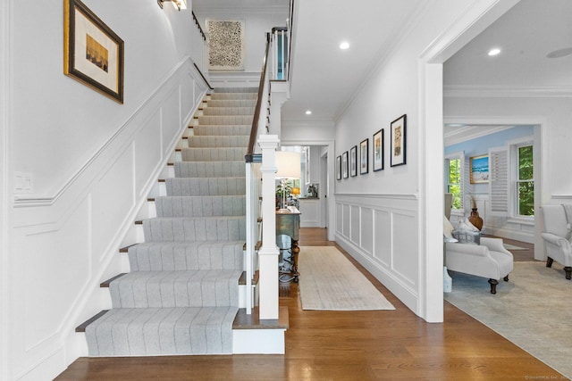 5 Oakleigh Ct, Norwalk, CT 06853 - stairway featuring a decorative wall, ornamental molding, recessed lighting, wood finished floors, and a wainscoted wall