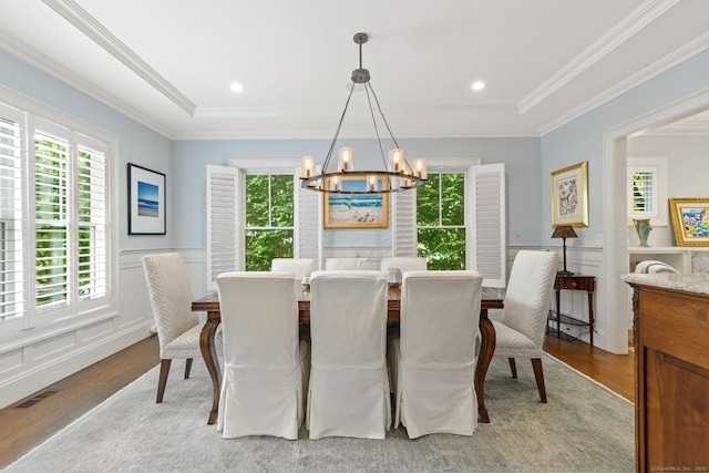5 Oakleigh Ct, Norwalk, CT 06853 - dining room featuring a chandelier, light wood-type flooring, healthy amount of natural light, ornamental molding, and a wainscoted wall