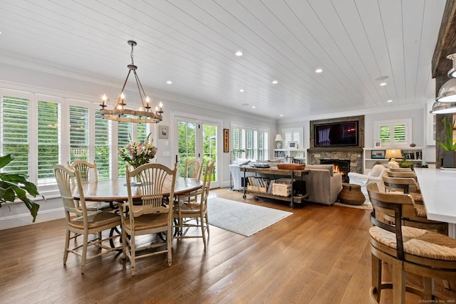5 Oakleigh Ct, Norwalk, CT 06853 - dining area with a fireplace, crown molding, recessed lighting, a chandelier, and light wood-style floors
