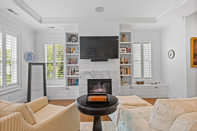 5 Oakleigh Ct, Norwalk, CT 06853 - living area featuring a high end fireplace, wood finished floors, healthy amount of natural light, and ornamental molding