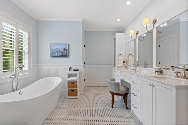 5 Oakleigh Ct, Norwalk, CT 06853 - bathroom featuring a freestanding bath, double vanity, a wainscoted wall, ornamental molding, and recessed lighting