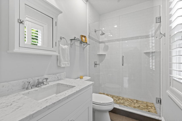 5 Oakleigh Ct, Norwalk, CT 06853 - bathroom featuring vanity, a stall shower, toilet, and tile patterned floors