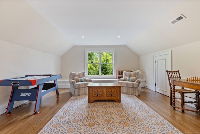 5 Oakleigh Ct, Norwalk, CT 06853 - living area with wood finished floors, vaulted ceiling, and baseboards