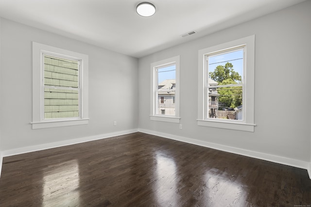 17 May St, Ansonia, CT 06401 - spare room featuring dark wood-style flooring and baseboards