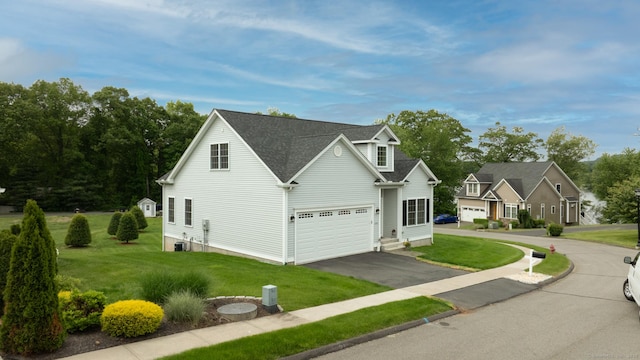 100 Silver Island Way Unit 100, Berlin, CT 06037 - traditional-style home with driveway, a front yard, central AC unit, and roof with shingles
