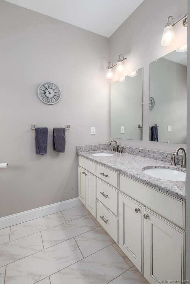 100 Silver Island Way Unit 100, Berlin, CT 06037 - bathroom with marble look tiles, double vanity, and baseboards