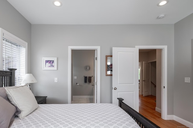 100 Silver Island Way Unit 100, Berlin, CT 06037 - bedroom featuring multiple windows, wood finished floors, baseboards, and recessed lighting