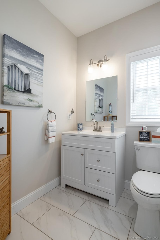 100 Silver Island Way Unit 100, Berlin, CT 06037 - bathroom with marble look tile flooring, vanity, baseboards, and toilet