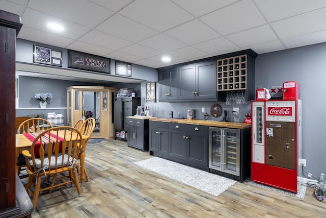 100 Silver Island Way Unit 100, Berlin, CT 06037 - indoor wet bar featuring beverage cooler, a drop ceiling, and light wood-style floors