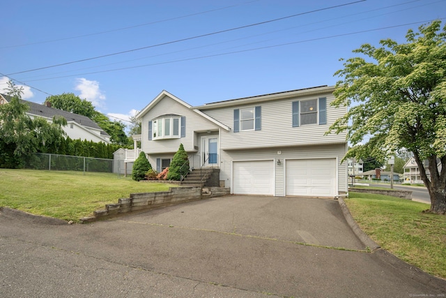 8 Lindsley St, Waterbury, CT 06708 - raised ranch featuring asphalt driveway and an attached garage