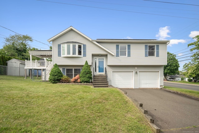 8 Lindsley St, Waterbury, CT 06708 - bi-level home featuring an attached garage, asphalt driveway, and stairs