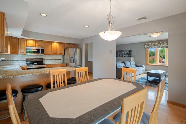 8 Lindsley St, Waterbury, CT 06708 - dining room featuring baseboards, light wood finished floors, and recessed lighting