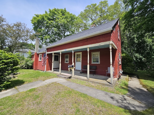 100 Morin Ave, Killingly, CT 06239 - view of front of home featuring a porch and a front lawn