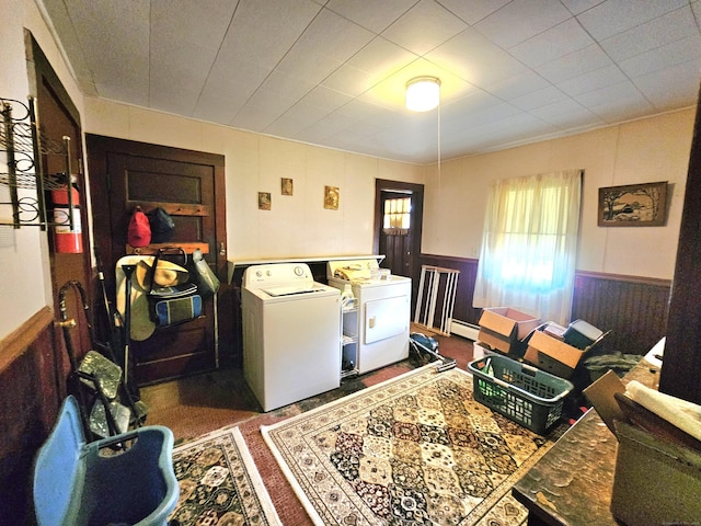 100 Morin Ave, Killingly, CT 06239 - laundry area featuring washing machine and clothes dryer, a wainscoted wall, baseboard heating, and wood walls