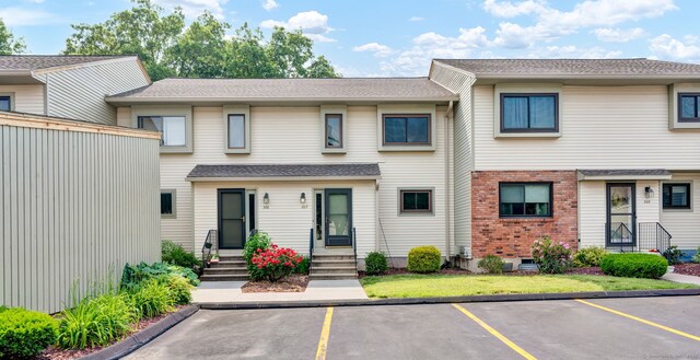207 Summer Hill Dr Unit 207, South Windsor, CT 06074 - view of property with uncovered parking, entry steps, and brick siding