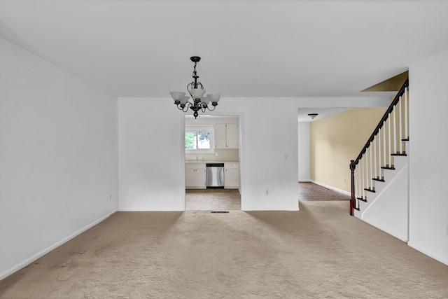 207 Summer Hill Dr Unit 207, South Windsor, CT 06074 - unfurnished living room with light colored carpet, a chandelier, and stairs