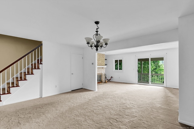 207 Summer Hill Dr Unit 207, South Windsor, CT 06074 - unfurnished living room with carpet, stairway, a chandelier, and a brick fireplace