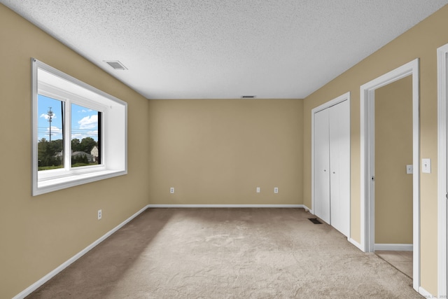 207 Summer Hill Dr Unit 207, South Windsor, CT 06074 - unfurnished bedroom with carpet, a textured ceiling, and a closet