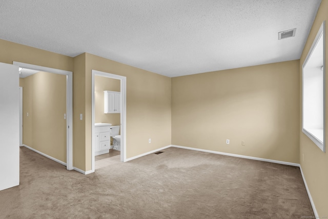 207 Summer Hill Dr Unit 207, South Windsor, CT 06074 - unfurnished bedroom featuring carpet, a textured ceiling, and ensuite bathroom