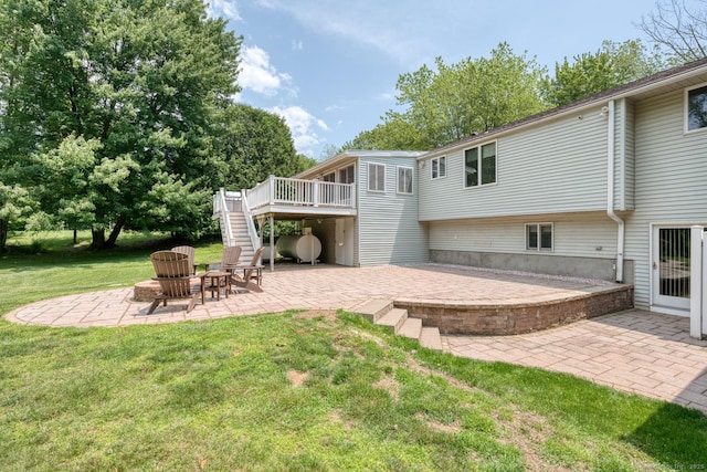 169 Dunn Rd, Coventry, CT 06238 - rear view of house with stairs, a patio area, a deck, a yard, and an outdoor fire pit