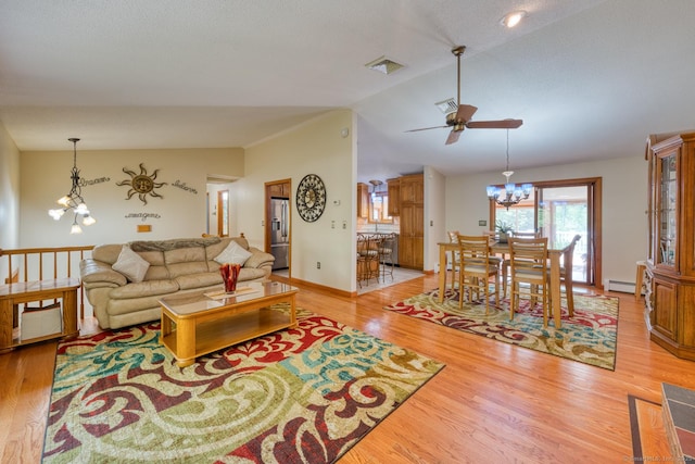 169 Dunn Rd, Coventry, CT 06238 - living area featuring lofted ceiling, ceiling fan, a chandelier, light wood-style flooring, and a baseboard radiator