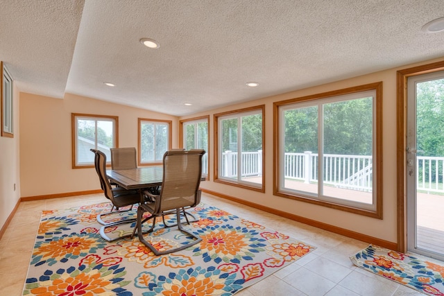 169 Dunn Rd, Coventry, CT 06238 - dining area with a textured ceiling, healthy amount of natural light, light tile patterned floors, lofted ceiling, and recessed lighting