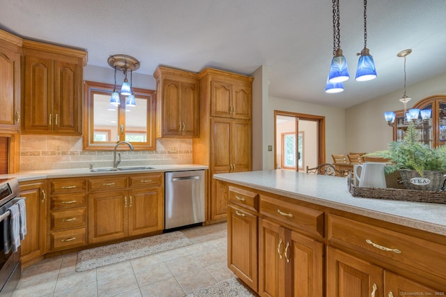 169 Dunn Rd, Coventry, CT 06238 - kitchen featuring stainless steel appliances, brown cabinetry, and healthy amount of natural light