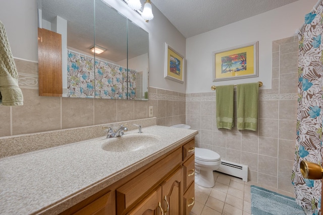169 Dunn Rd, Coventry, CT 06238 - full bath with baseboard heating, vanity, tile patterned floors, a shower with curtain, and tile walls