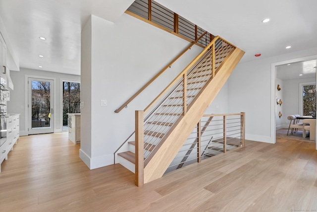 261 N St, Ridgefield, CT 06877 - stairway featuring wood finished floors, recessed lighting, plenty of natural light, and baseboards