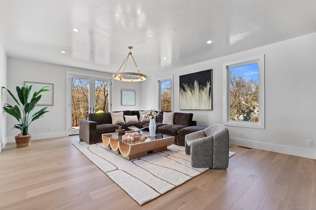 261 N St, Ridgefield, CT 06877 - living area with recessed lighting, light wood finished floors, and baseboards