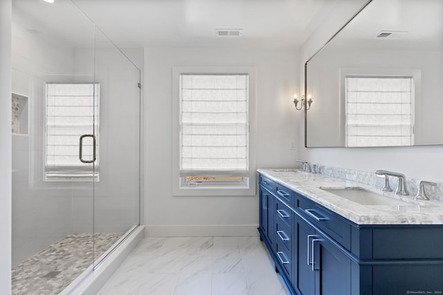 261 N St, Ridgefield, CT 06877 - full bathroom with double vanity, a stall shower, marble finish floors, and baseboards