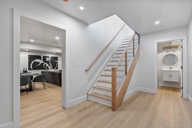 261 N St, Ridgefield, CT 06877 - staircase featuring wood finished floors, baseboards, and recessed lighting