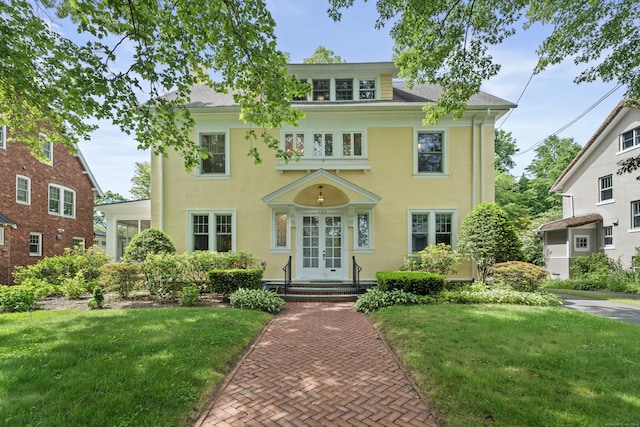 168 Westwood Rd, New Haven, CT 06515 - view of front of home featuring french doors, a front yard, and stucco siding
