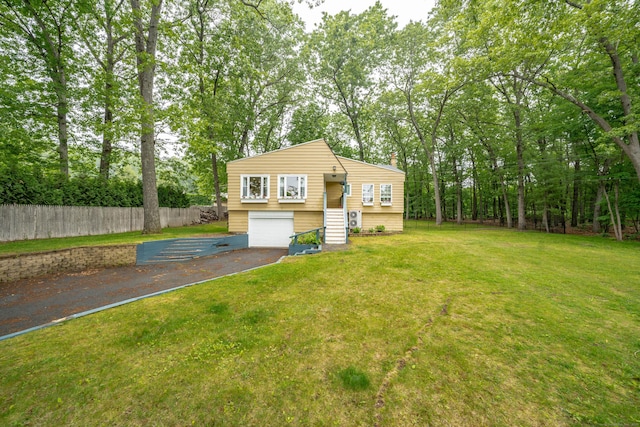211 Brainard Rd, Enfield, CT 06082 - view of front facade featuring driveway, a garage, and a chimney