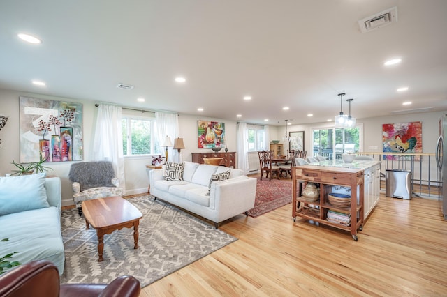 211 Brainard Rd, Enfield, CT 06082 - living room featuring recessed lighting, light wood-style flooring, healthy amount of natural light, and baseboards