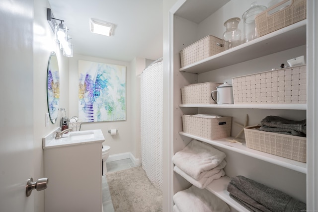 211 Brainard Rd, Enfield, CT 06082 - full bath featuring vanity, toilet, and tile patterned floors