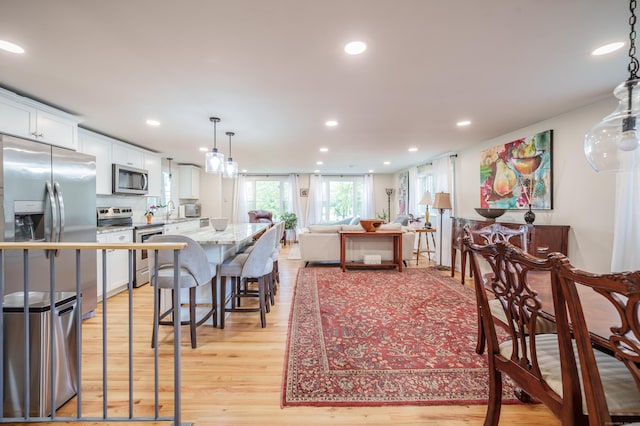 211 Brainard Rd, Enfield, CT 06082 - dining room featuring light wood finished floors and recessed lighting