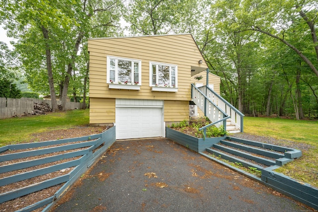211 Brainard Rd, Enfield, CT 06082 - view of front of house featuring driveway, stairs, and an attached garage