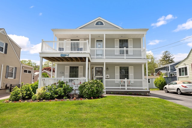 26 Parkway S, New London, CT 06320 - view of front of property featuring covered porch, a balcony, and a front yard