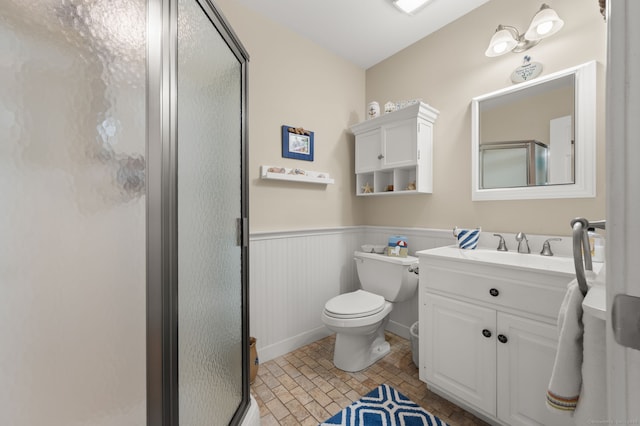 26 Parkway S, New London, CT 06320 - bathroom with a stall shower, wainscoting, vanity, and toilet