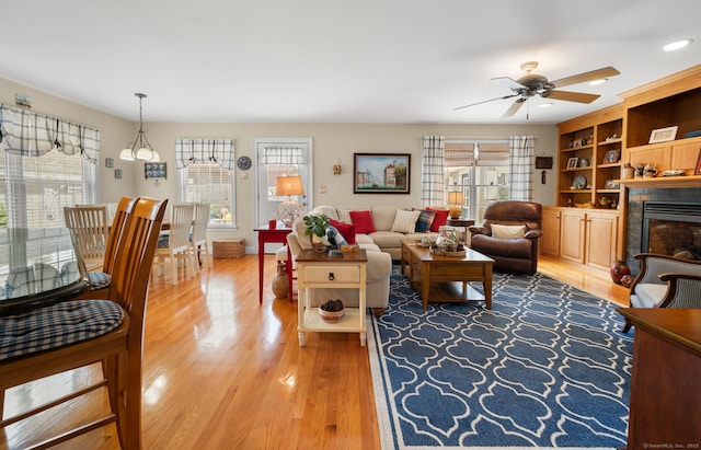 26 Parkway S, New London, CT 06320 - living room with ceiling fan, light wood-type flooring, a fireplace, and recessed lighting