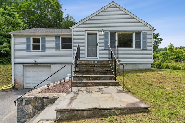 4 Buttonball Dr, Newtown, CT 06482 - view of front of property featuring an attached garage, a front yard, entry steps, driveway, and roof with shingles