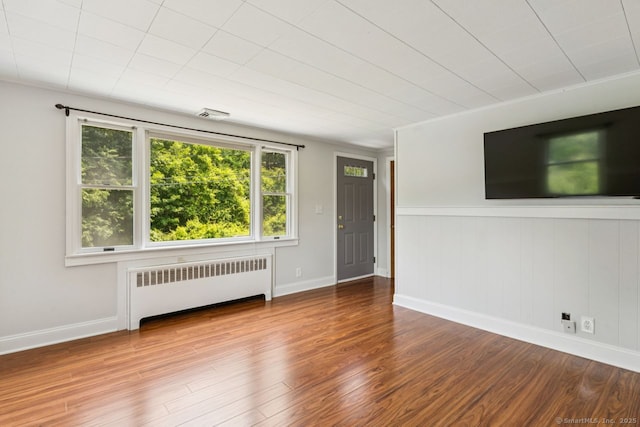 4 Buttonball Dr, Newtown, CT 06482 - unfurnished room featuring radiator heating unit and wood finished floors