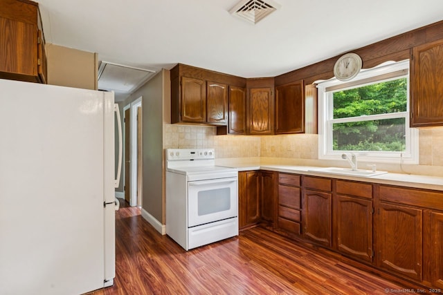 4 Buttonball Dr, Newtown, CT 06482 - kitchen featuring white appliances, dark wood-style floors, light countertops, and decorative backsplash