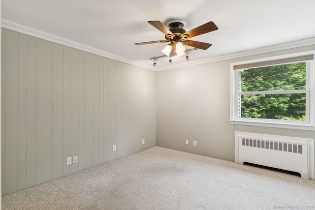 4 Buttonball Dr, Newtown, CT 06482 - carpeted spare room with radiator, healthy amount of natural light, a ceiling fan, ornamental molding, and wooden walls