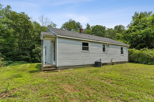 4 Buttonball Dr, Newtown, CT 06482 - view of property exterior featuring a lawn, a chimney, and entry steps