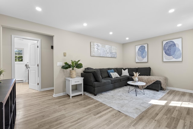 13 Williams Ct, Wolcott, CT 06716 - living area with baseboards, light wood finished floors, recessed lighting, and a baseboard radiator