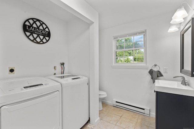 13 Williams Ct, Wolcott, CT 06716 - laundry room with a baseboard radiator, washing machine and dryer, light tile patterned floors, and baseboards