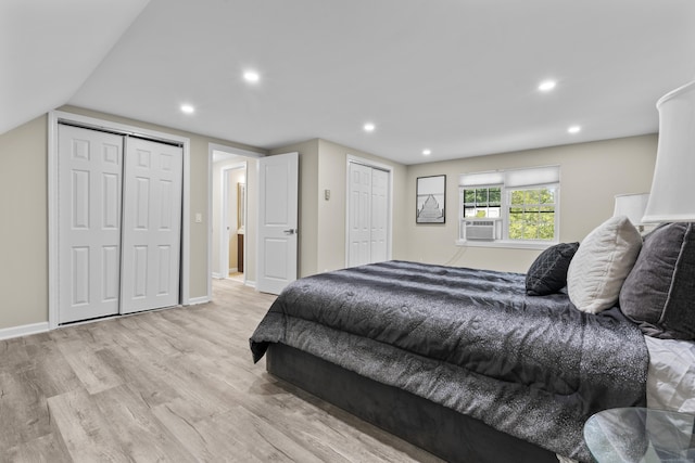 13 Williams Ct, Wolcott, CT 06716 - bedroom with two closets, light wood-type flooring, cooling unit, recessed lighting, and baseboards