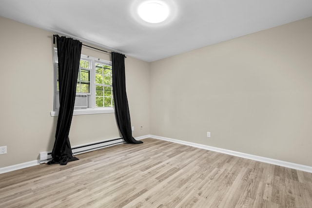 13 Williams Ct, Wolcott, CT 06716 - empty room featuring light wood-style flooring, baseboards, and baseboard heating